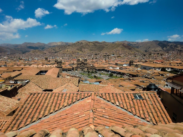 Red clay roofs of the houses in the city of Cusco Peru