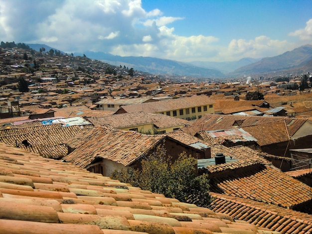 Red clay tile roofs of a town in the highlands of Peru