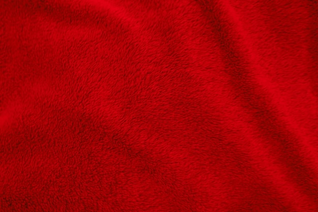 Red clean wool texture background light natural sheep wool red seamless cotton texture of fluffy fur for designers closeup fragment red wool carpet