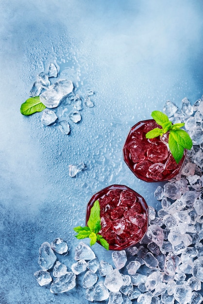 Red coctail with ice and mint