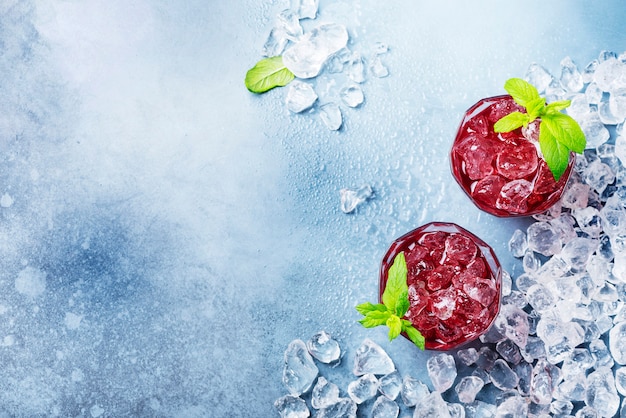 Red coctail with ice and mint