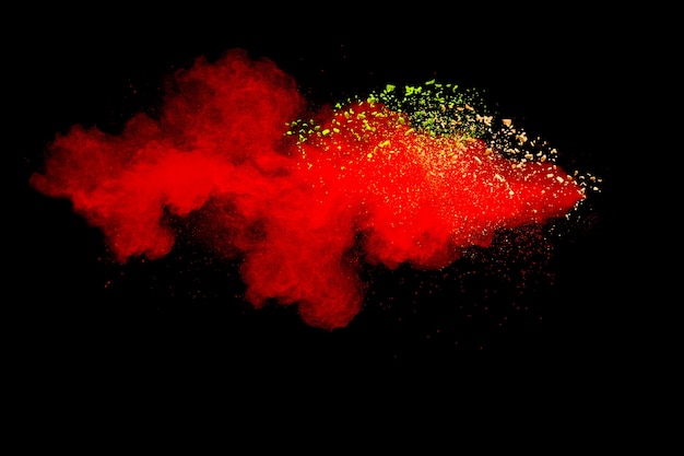 red color powder explosion on black background.