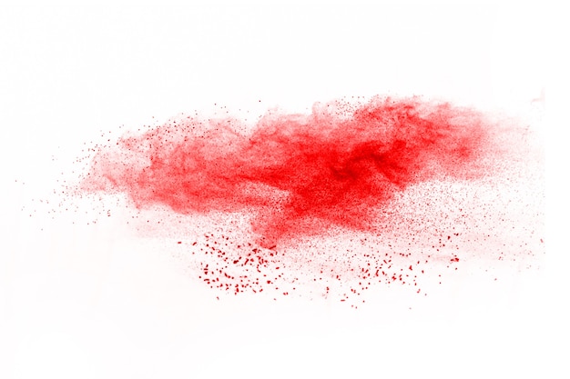 Red color powder explosion on white background