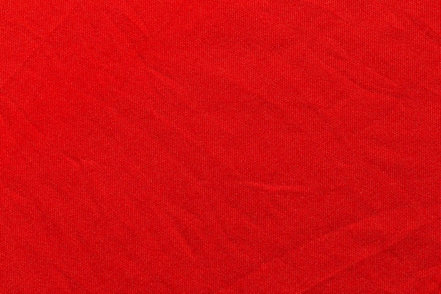 Red color sports clothing fabric football shirt jersey texture and textile background