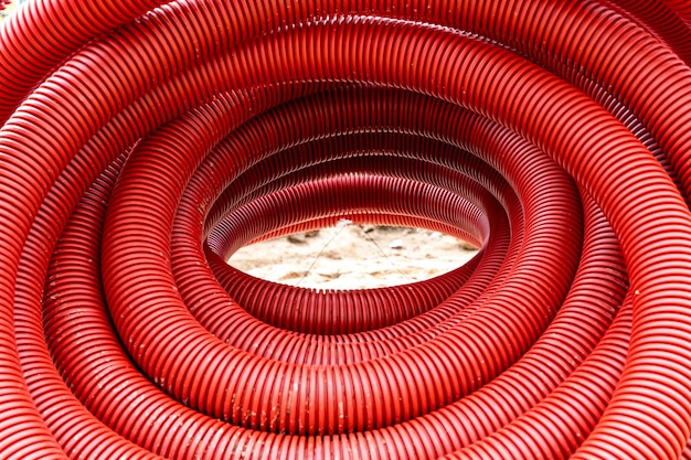 Red corrugated pvc pipe for underground electrical cable laying