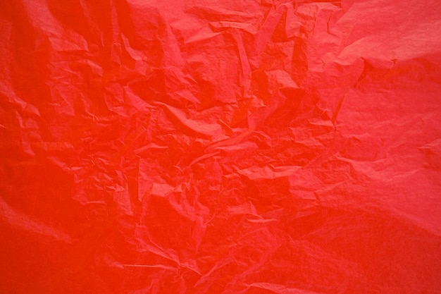 Red crumpled paper texture background