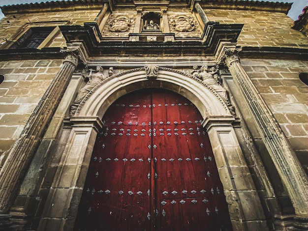 Photo red door of a church