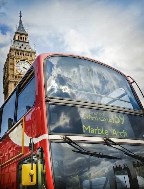 Red double decker bus and Big Ben in London, UK