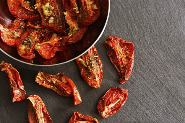 Red dried slices of tomato, Homemade sundried pomodoro. 