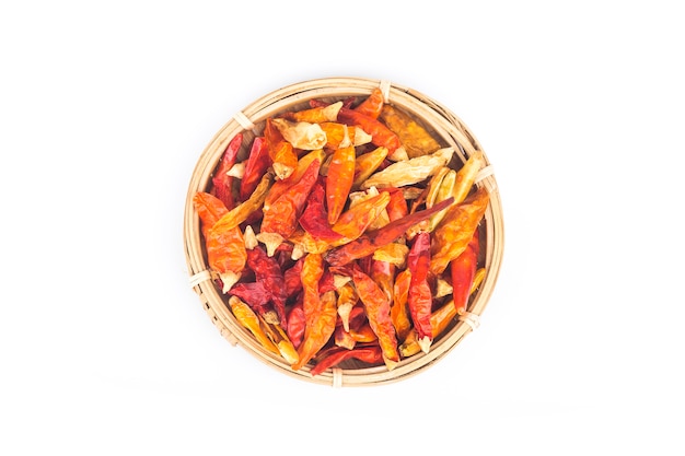 Red dry chili in a small bowl, isolated on white