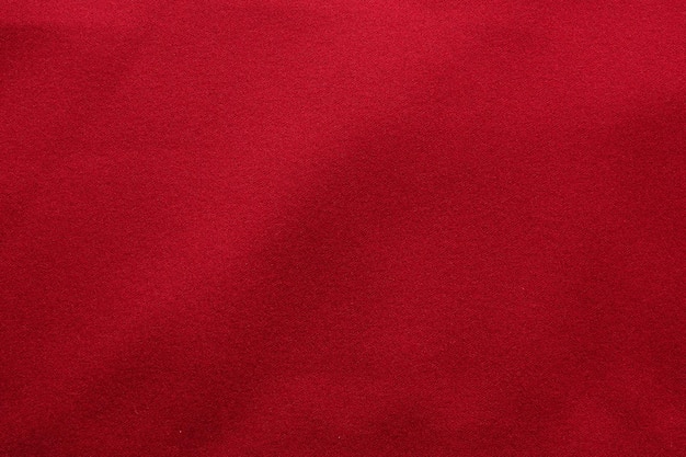 Red fabric texture background close up