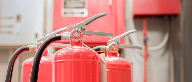 The red fire extinguisher is ready for use in case of an indoor fire emergency