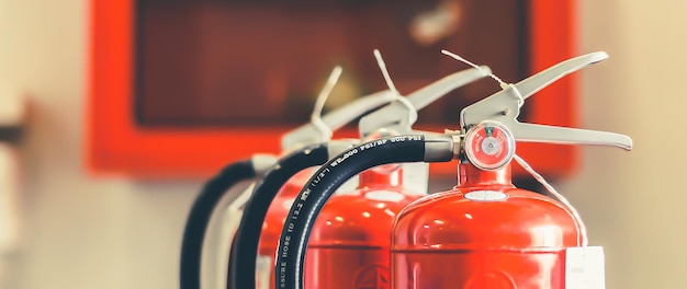 Photo the red fire extinguisher is ready for use in case of an indoor fire emergency