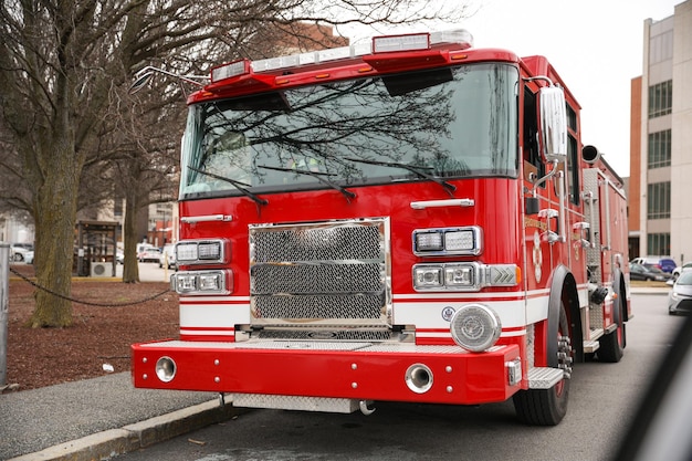 A red fire truck is parked on the street.