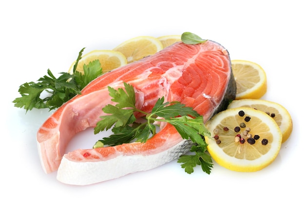 Red fish with lemon parsley and pepper isolated on white