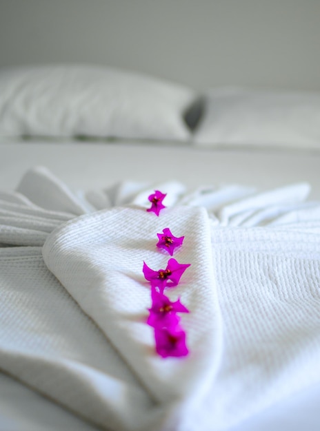 RED FLOWERS ON A WHITE BLANKET