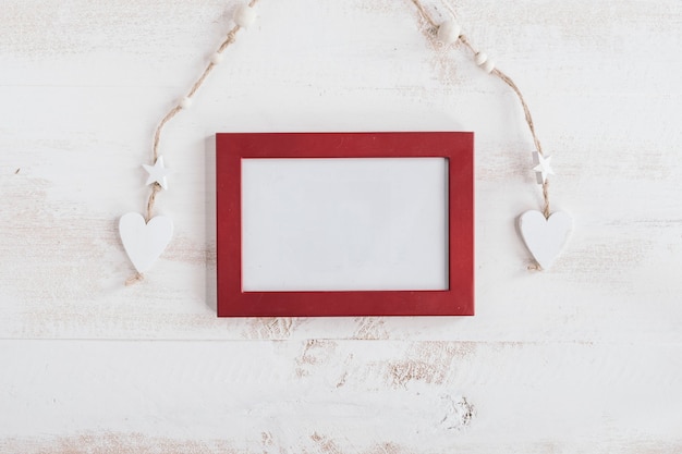 Red frame with white wooden hearts