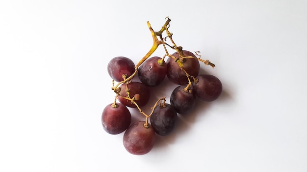 Red fresh grapes red grapes display on white background