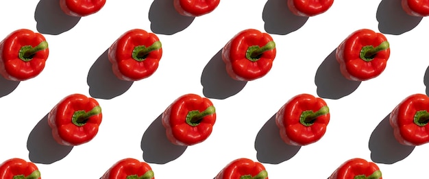 Red fresh paprika pepper on a white background Top view flat lay Banner