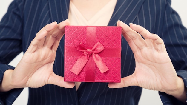 Red gift box from business woman