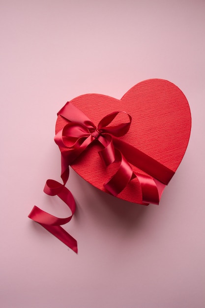 Red gift box heart shape with red ribbon