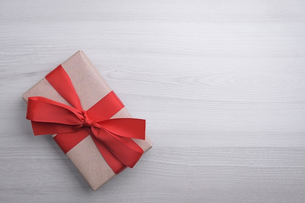 Red gift ribbons, gifts, on  wooden. Top view.