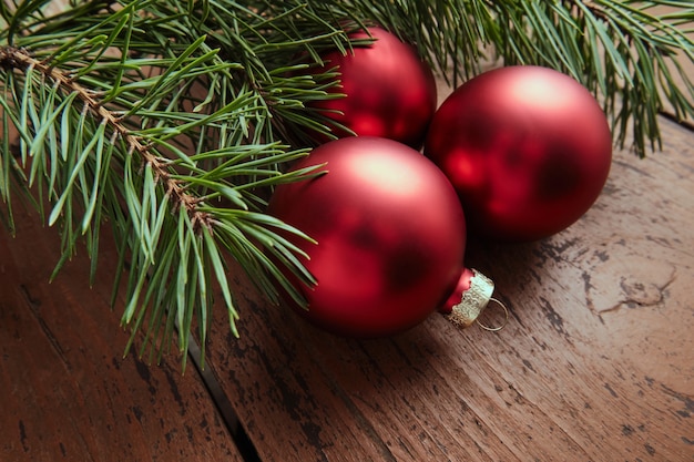 Red Glass Balls, Green Spruce Branches. Christmas and New Year