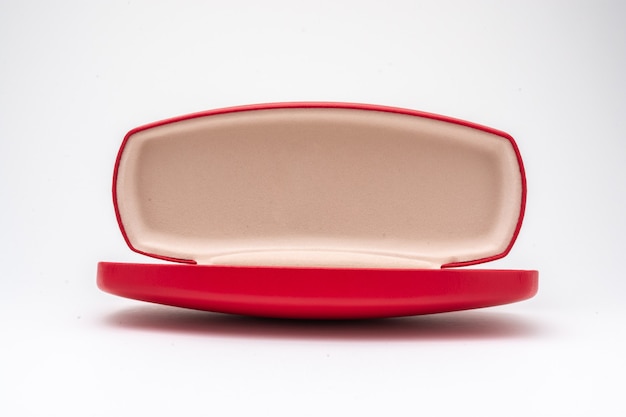 Red glasses case open in white background