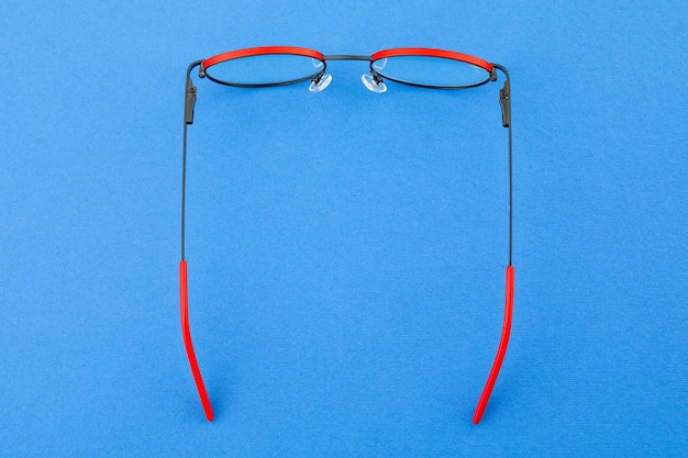 red glasses, on color background