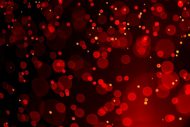 Red glitter vintage lights background defocused