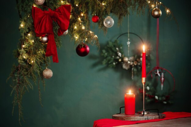 red and golden christmas decor on table on dark background