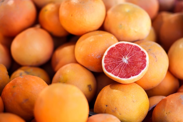 Red grapefruit background on a shelf in market Organic eating Farmer's food Close up