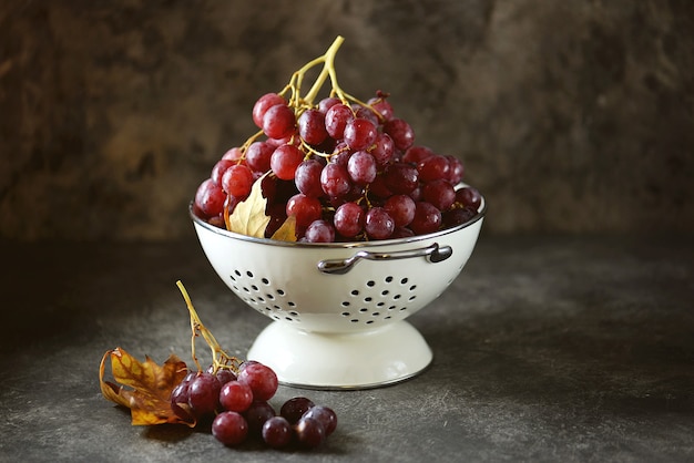 Red grapes in a white colander