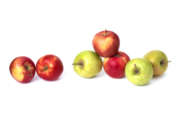 Red and green apples on a white background. Green and red juicy apples on an isolated background. A group of ripe apples on a white background.