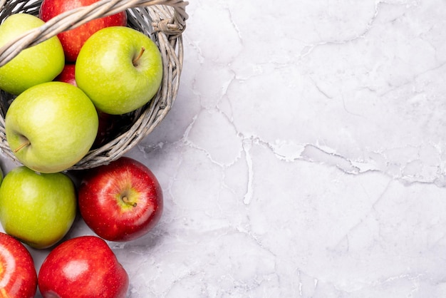 Red and green garden apples in basket