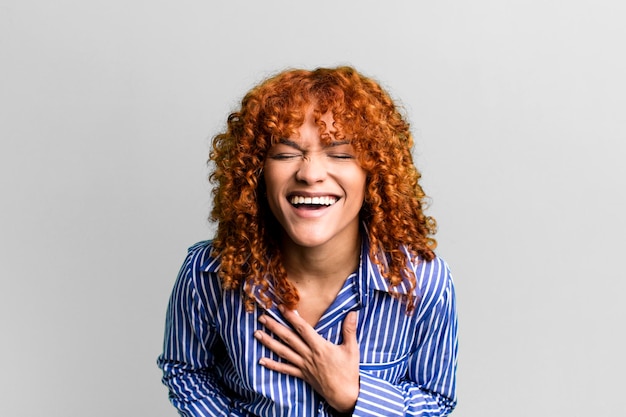 Red hair pretty woman against isolated background