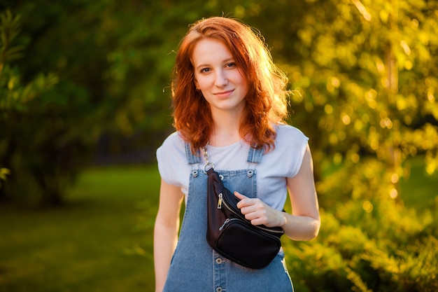 Red-haired girl with waist bag