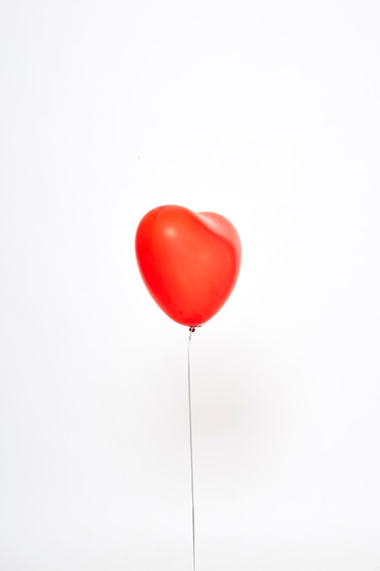 red heart balloons on a white 