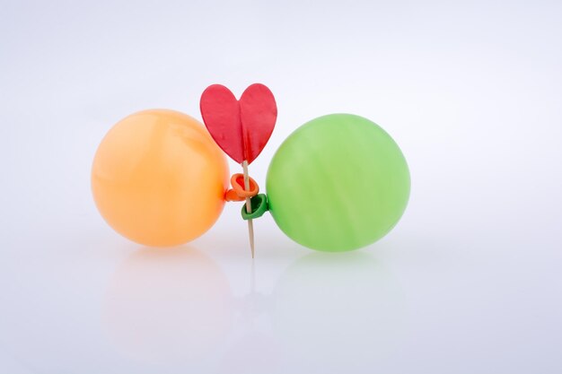 Red heart and colorful small Balloons