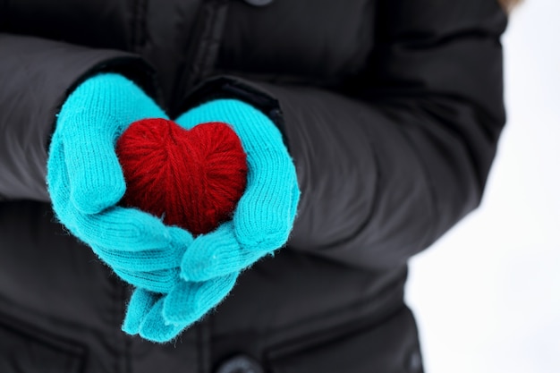 Red heart in hands close-up on valentine's day