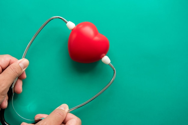 Red heart shape ball with stethoscope