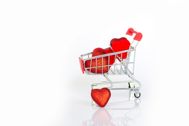 Red heart shape on cart. Concept of love for sale. Valentine event.