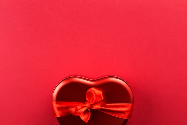 Red heart-shaped box with ribbon