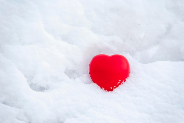 Red heart in the snow