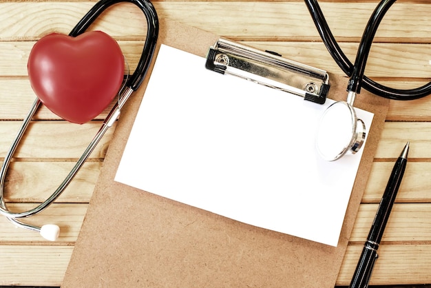 Red heart and a stethoscope, health and doctor