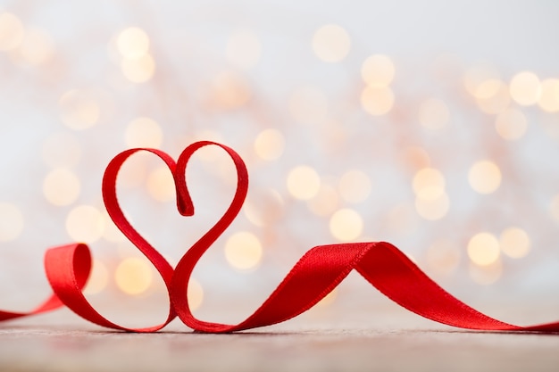 Red heart with ribbon. Valentines day background.