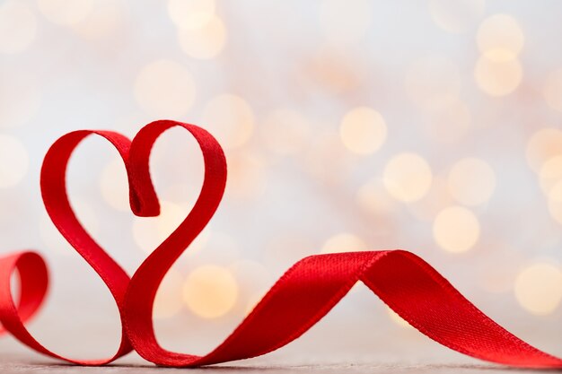 Red heart with ribbon. Valentines day background.