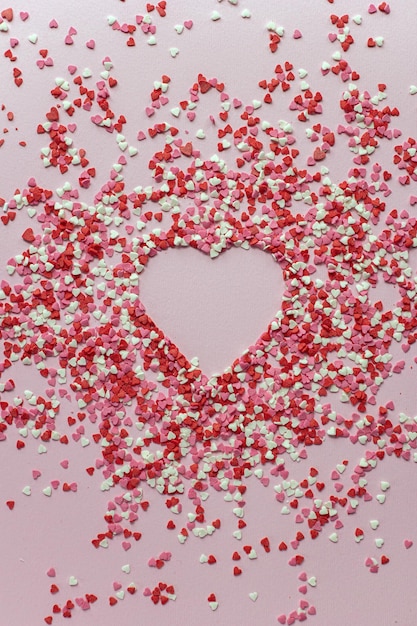 Red heart with sparkles on pink background Valentines Day International Women's Day template