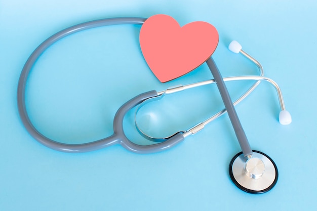 Red heart with stethoscope health insurance concept