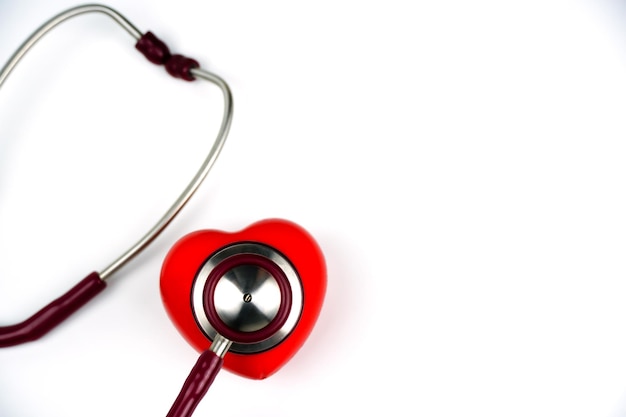 Red heart with stethoscope on white background Selective focus health and Medical concept